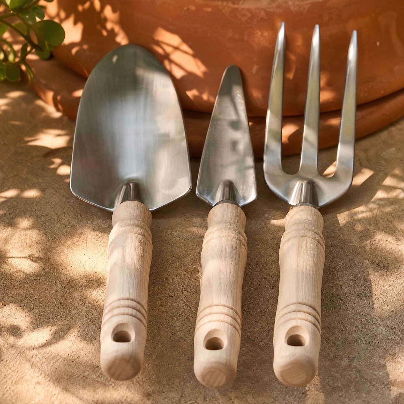 Hand Tool Set of Three — detail of the three turned ash handles and hanging holes lined up
