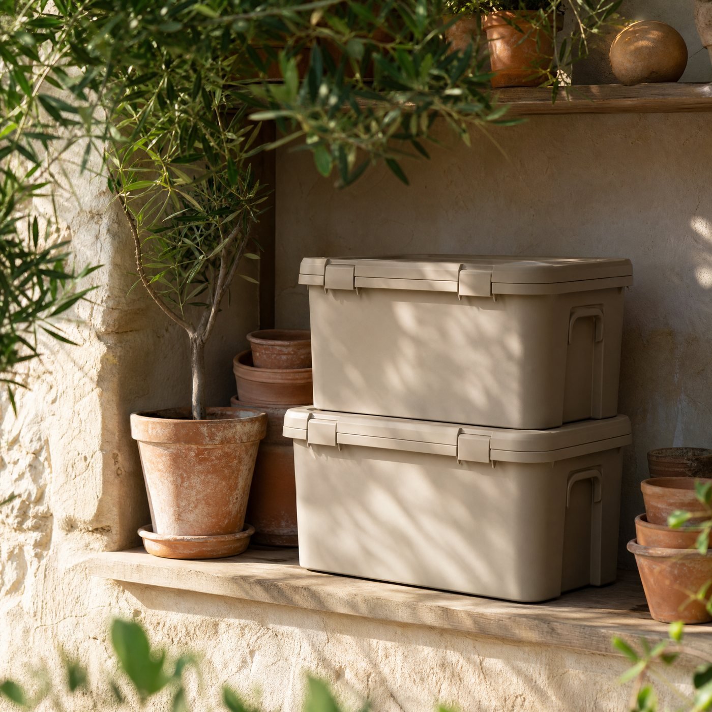 Stackable Storage Box, 30 L — a garden shed shelf with two of these oat boxes stacked beside terracotta pots