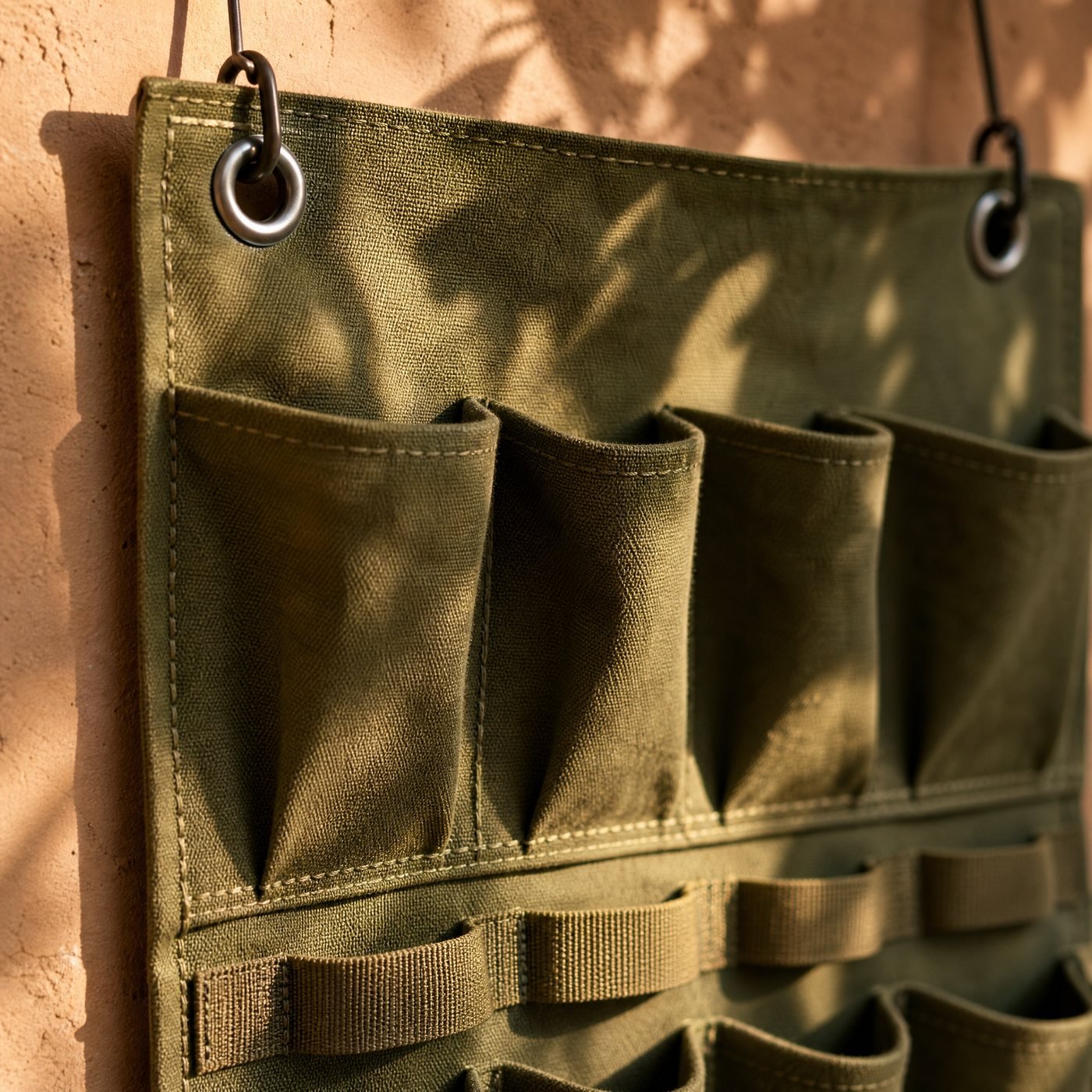 Hanging Tool Organiser — detail of a stitched pocket and a metal eyelet