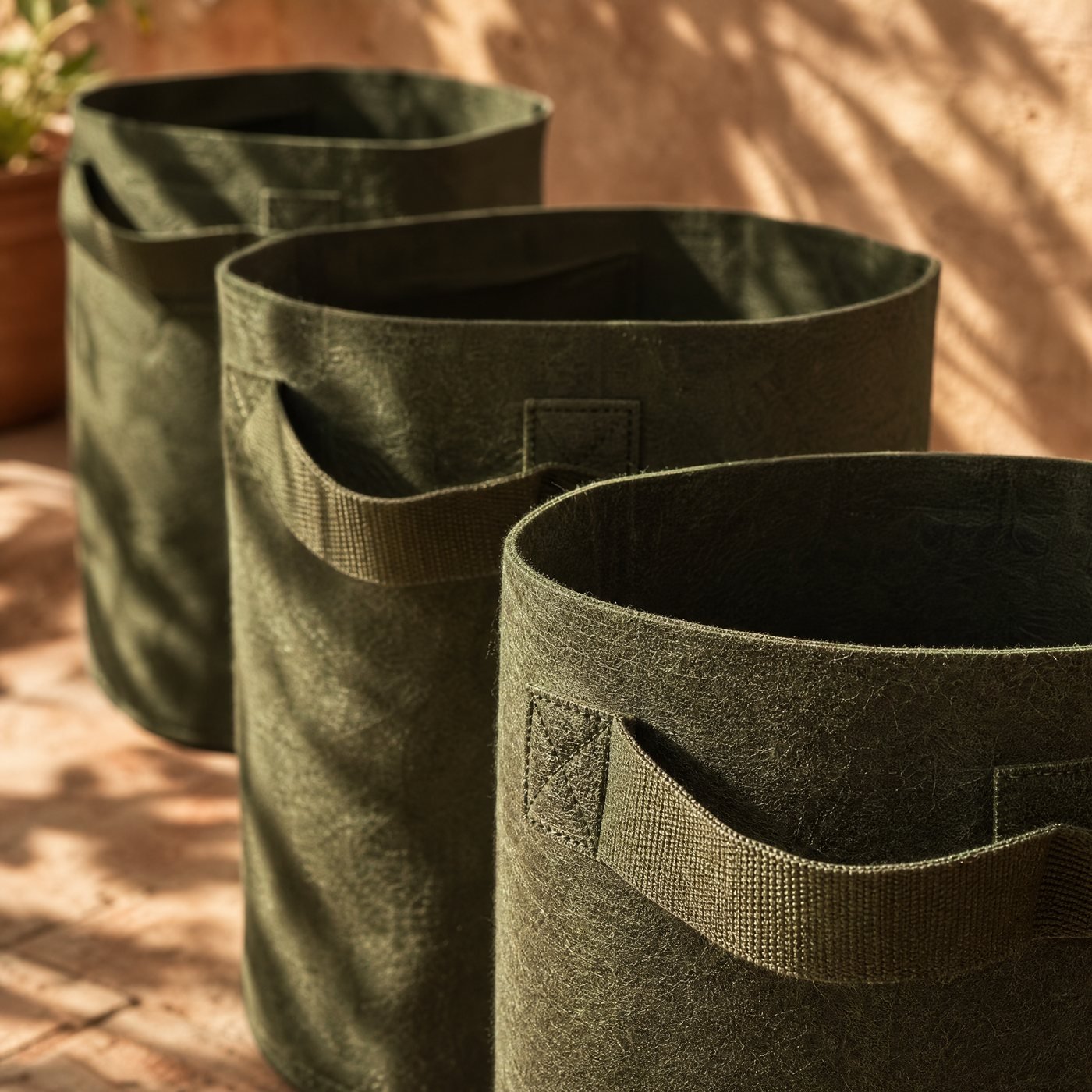Non-woven Grow Bags, Set of 3 — detail of the felt-like non-woven fabric texture and the stitched handle